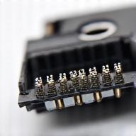 A detailed image of an inkjet printer printhead, showing the intricate nozzle array.